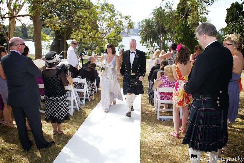 Bride and groom walking down aisle - wedding photography sydney